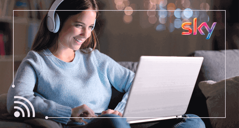 Woman wearing headphones using a laptop